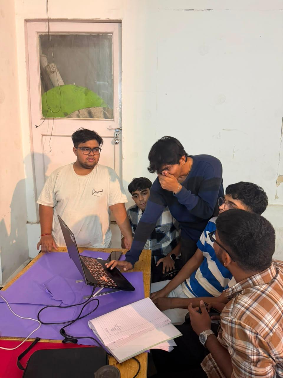 Members debugging on laptop